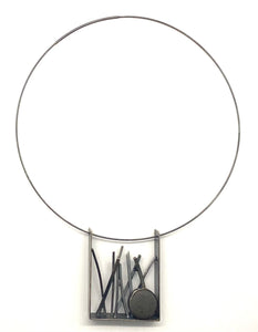 Tall grass and rock pendant