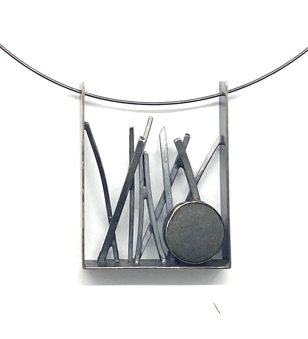 Tall grass and rock pendant