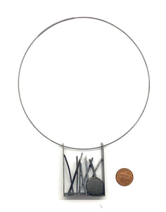 Tall grass and rock pendant